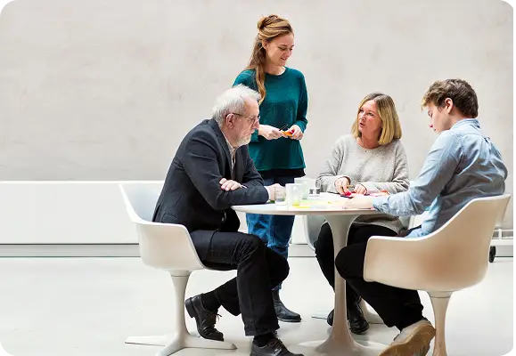 A group of people sitting at a table